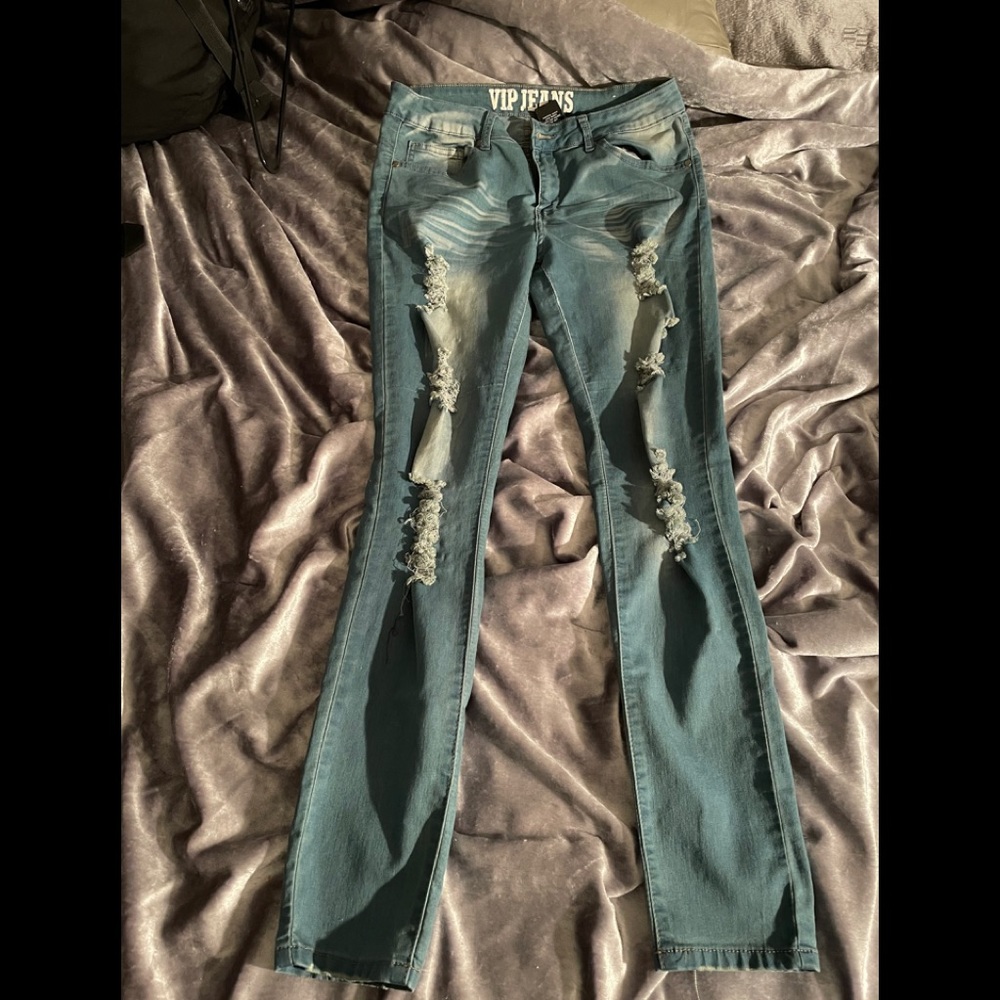 Distressed denim blues jeans